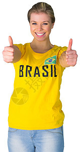 穿胸罩T恤的漂亮的足球球迷绿色手势微笑黄色双手世界女士支持者扇子影棚图片