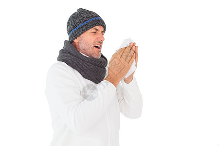 寒冬时的生病男人打喷嚏羊毛帽子围巾感染组织衣物男性鼻涕流感疾病图片