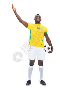 整个巴西足球运动员的全年运动手势支持者男人男性黑色运动服微笑黄色竞技图片