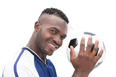 一个微笑的英俊足球运动员的近距离肖像背景图片