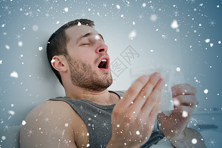 生病男人打喷嚏的复合图像图片