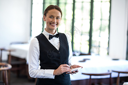 服务员下订单微笑衬衫女士女性餐厅记事本领结套装头发酒店图片