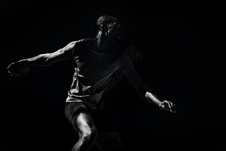 运动员扔盘片的复合形象 人屏幕专注计算机绘图男人广告短裤广告牌黑色背心图片