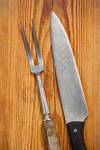 木制背景的刀和叉烹饪厨具营养炊具金属餐具木板美食厨房桌子图片
