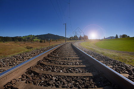 瑞士的铁轨在地平线上汇合太阳墙纸金属旅行铁路阳光蓝天过境国家运输图片