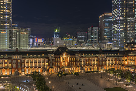 东京火车站Marunouchi一侧夜景干线照片首都天线红砖阴影铁路皇宫建筑摩天大楼图片