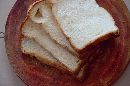 白面包的切片乡村面团饮食木头粮食美食早餐谷物种子酵母图片