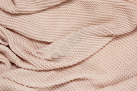 美利奴针织棉波浪格子顶视图的纹理表面 柔软的尘土飞扬的粉色柔和羊毛背景 季节性舒适平躺 斯堪的纳维亚极简风格 呆在家里舒适的女性气质概背景