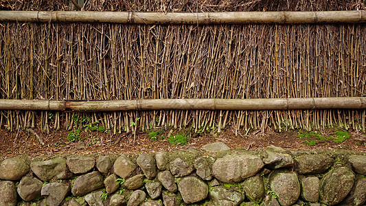 户外花园中的天然竹纹理墙背景石头热带棕色岩石边界框架栅栏植物木板木头图片