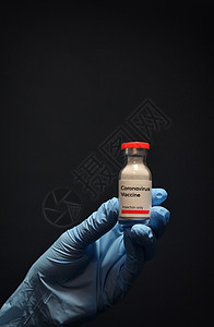 与手套一起持有科罗纳病毒疫苗解药注射器病理女士发烧口罩疫苗护士实验室感染图片