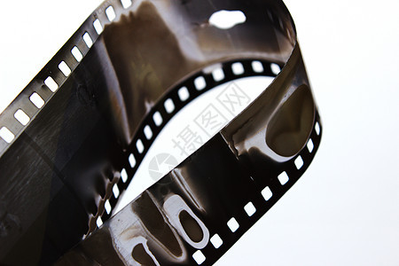 在螺旋的老黑白影片在白色背景 老复古片 非常老的黑白电影幻灯片相机胶卷照片投影仪古董艺术摄影师摄影娱乐图片