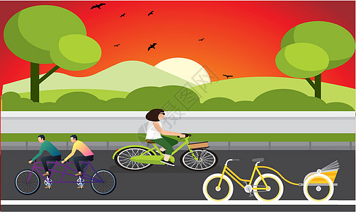 自行车和三轮自行车在夜间行驶闲暇乐趣三轮车公园天空卡通片日落女孩娱乐运动图片