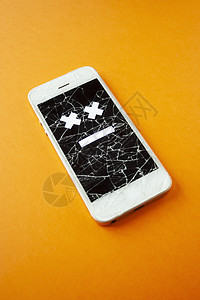 碎石破碎的智能手机技术展示屏幕维修裂缝细胞橙子事故玻璃碰撞图片
