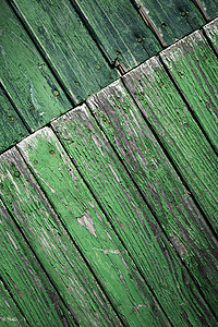 斜转旧绿色木面板图片
