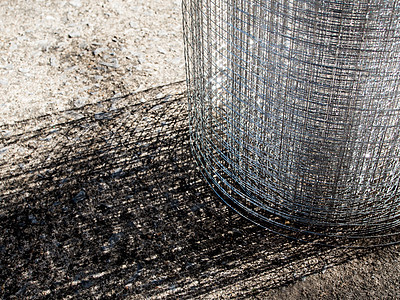 光闪闪发光的薄线板网格栅栏金属灰色安全建造工业背景图片