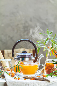 热辣辣茶 有杯子和茶壶中的海角药品饮料橙子玻璃收成浆果植物桌子食物灌木图片