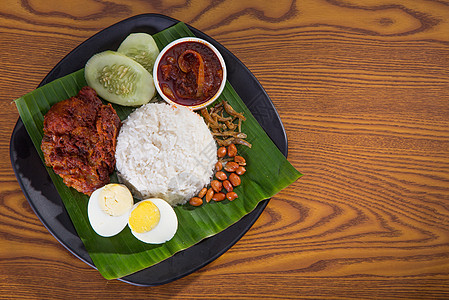 一种传统的咖哩面糊米饭马来语美食香料盘子文化烹饪黄瓜食物椰子早餐图片