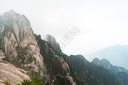 中国安徽黄山叶洛山地貌景观天线悬崖绿色植物日落天空旅游旅行松树顶峰树木图片