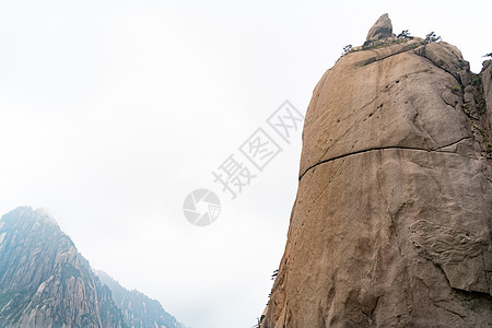 中国安徽黄山叶洛山地貌景观日落天空悬崖顶峰远足树木绿色植物岩石旅游臭氧图片