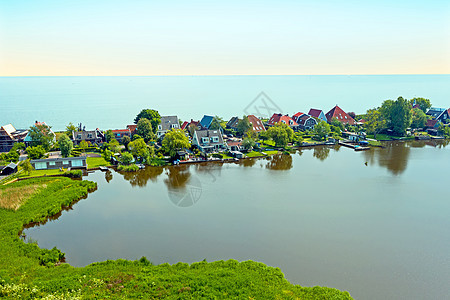 从IJsselmeer的Uitdam传统村村庄旅游旅行建筑草地天线风景房子建筑学历史图片