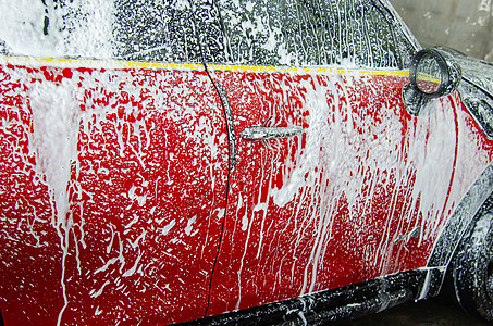 用泡沫泡洗车肥皂工人窗户工作垫圈服务车辆男人车库车站图片