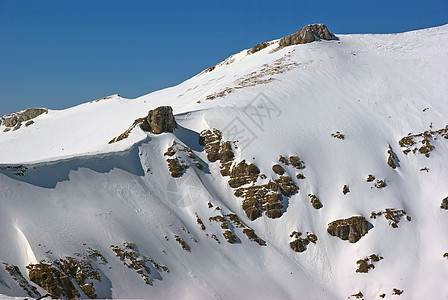 山的冬季风景岩谷高度旅游太阳天空旅行高山爬坡环境冒险图片