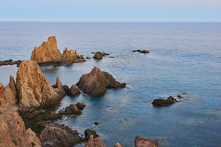 处性悬崖假期日落孤独天堂旅游蓝色荒野旅行海滩海岸图片