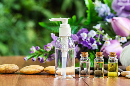温泉按摩用的瓶装基本油油草本植物疗法香水芳香医疗产品草本药品血清植物群图片