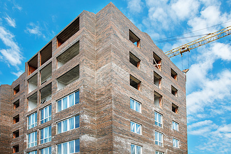 建造一座新的多层住宅楼 修建一栋多层新住房大楼城市蓝色工作建筑窗户财产房子商业玻璃天空图片