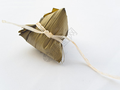 竹叶包装的粘糊饭 鸡蛋和猪肉月球粽子叶子竹子午餐塑料庆典棕色蛋黄食物图片