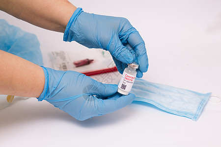 冠状病毒疫苗 有疫苗的医生 手拿着冠状病毒疫苗安瓿 Covid19蓝色剂量流感预防接种治疗手套疾病药品成人图片