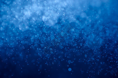 蓝色散景抽象背景雪花灰尘庆典魔法风格气泡卡片魅力墙纸派对图片