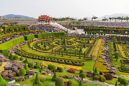 泰国巴塔亚Pattaya的Nong Nooch热带花园地标全景公园草地旅行天堂棕榈国家雕塑天空图片