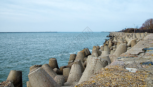 具有防水裂口的二次地平线港口安全支撑建造海浪石头海景海岸线蓝色图片