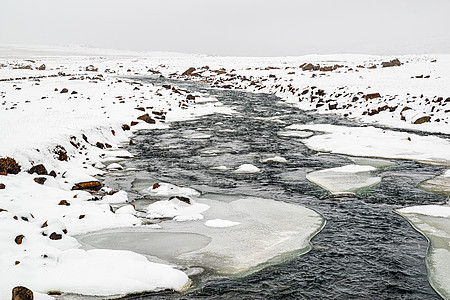 冰岛Snaedufos瀑布前的河流岩石公园白色水平旅行风景下雪图片