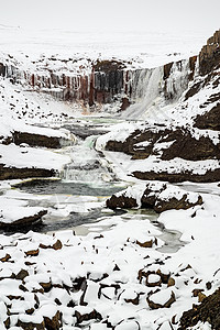 Snaedevofos瀑布 冰岛旅行下雪白色岩石公园风景图片