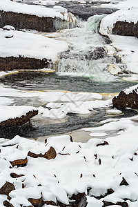 Snaedevofos瀑布 冰岛旅行下雪公园白色风景岩石图片