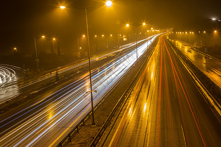 城市速度高速交通  夜间高速公路上的轻轨旅行日落城市场景头灯线条运动驾驶时间踪迹背景