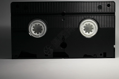 白色背景上的磁盘磁带录像带电视记录格式塑料娱乐电影标签视频运动图片