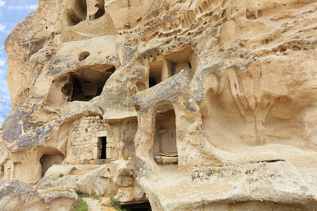 特写卡帕多西亚山谷的旧沙石洞穴住所图片