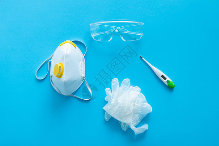 呼吸器ffp 橡胶手套 温度计和防护眼镜都放在蓝色背景上 抗病毒保护包 防腐蚀19;Corona病毒大流行2019年背景图片