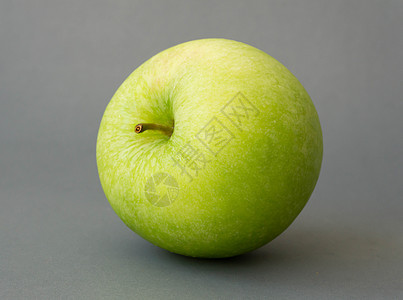 灰色背景的绿苹果 健康饮食果 c/背景图片