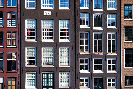 荷兰阿姆斯特丹运河上传统杜丘建筑 荷兰阿姆斯特丹遗产房子建筑学财产首都反射城市石头旅游石方图片