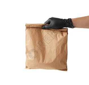 手握黑色乳胶手套 装满一整包棕色的纸袋卫生市场销售送货购物商业店铺命令食物预防图片