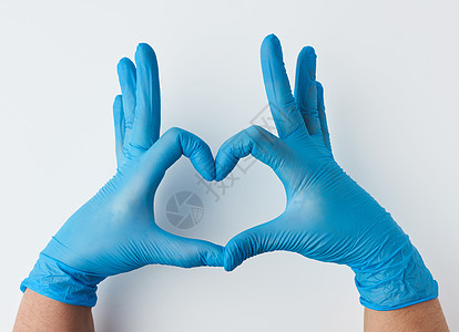 戴蓝色乳胶不育手套的两只手显示一个手势o图片