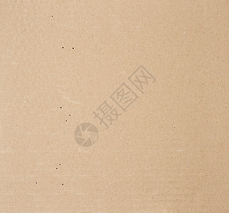 一块光滑的棕色硬纸板全纸框架木板卡片包装牛皮纸盒子回收空白送货生态黄色图片