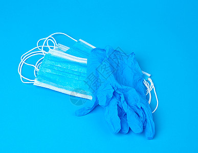 由非编织米制成的一次性手套和一叠医疗面具流感工作室外科医院保健诊所专家疾病治疗职业图片