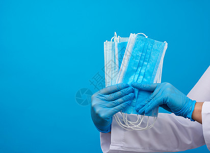 穿白色大衣的医生 蓝色乳胶消毒手套挂着纺织工作室工人女士成人安全诊所卫生护士疾病全科图片