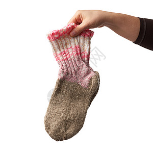 女用手握着一双毛绒袜子和温暖的衣服白色羊毛身体黄色短袜女孩条纹纺织品女士图片