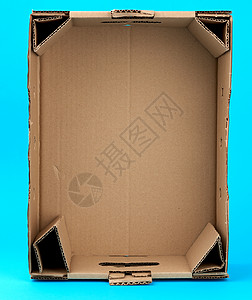 蓝色背木上棕色纸的长方形空纸板盒羊皮纸贮存空白回收包装褐色办公室瓦楞盒子仓库图片
